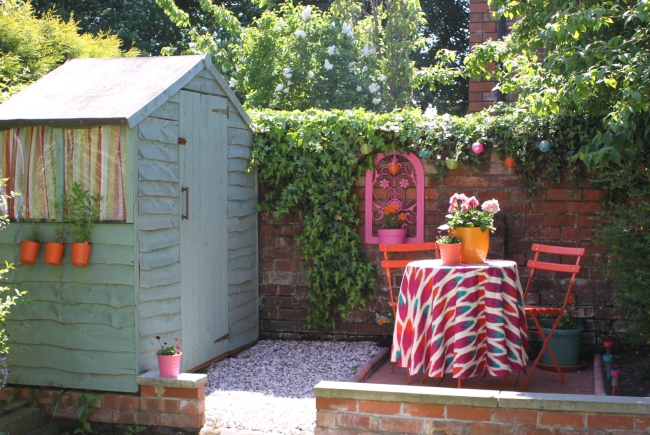 small shed and colourful patio