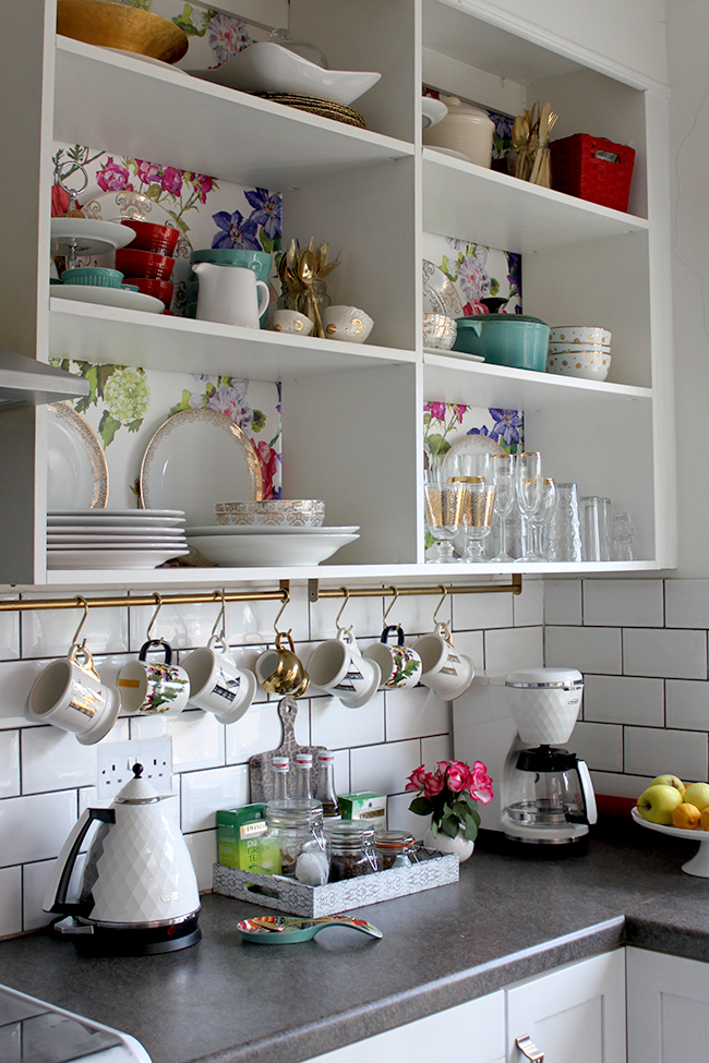 White kitchen with brass accents