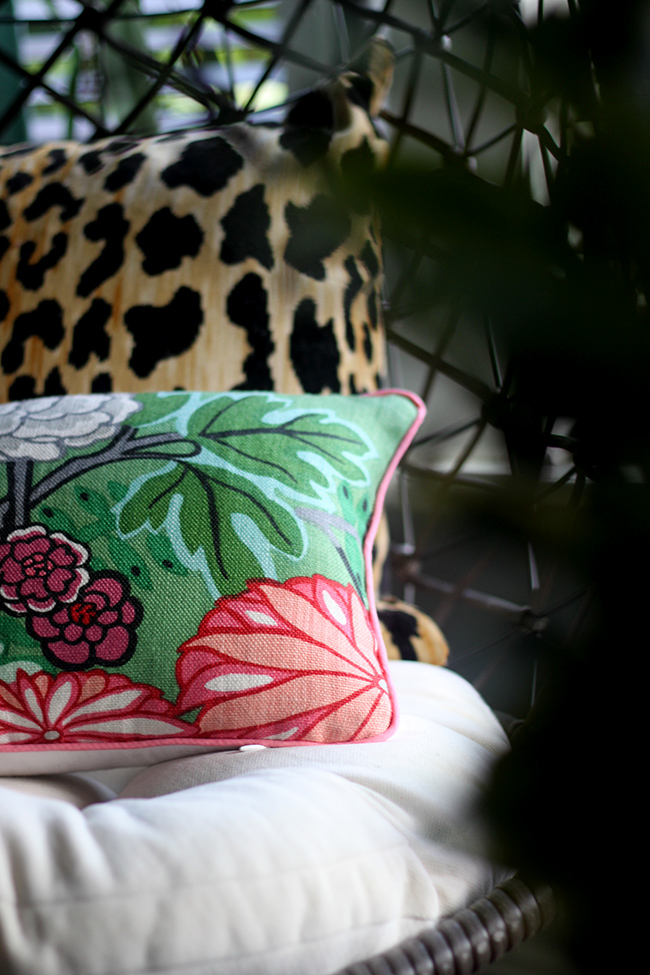 leopard print cushion and chaing mai dragon jade cushion on hanging chair from Out There Interiors