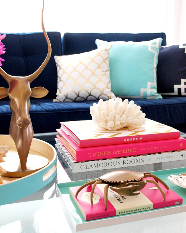 Gorgeous navy blue velvet sofas mixed with patterned cushions