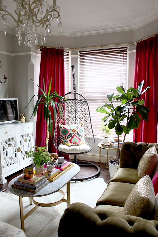 Swoon Worthy living room - olive green and berry with hanging chair