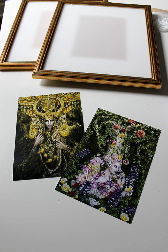 I added some of Kirsty Mitchell's work to my home by framing postcards as art