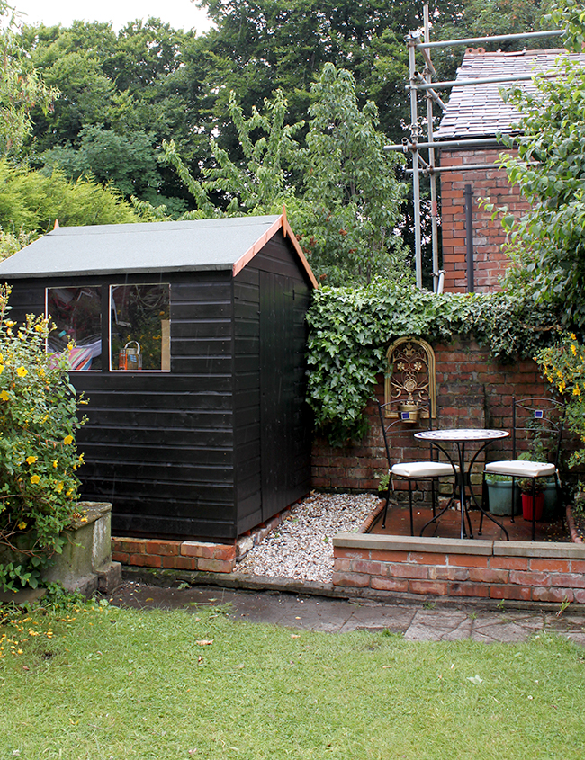 Swoon Worthy - Black Shed and brick patio