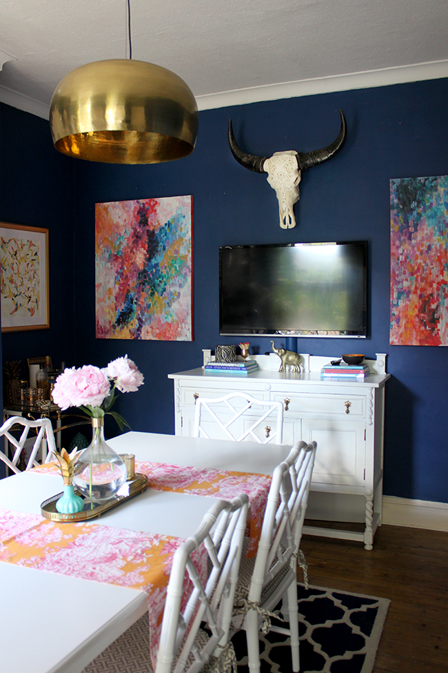 Swoon Worthy dining room in navy blue, pink and orange