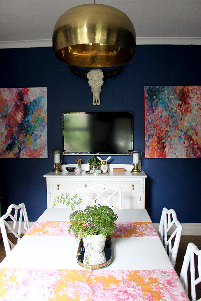 Swoon Worthy - dark blue dining room with white table and brass light