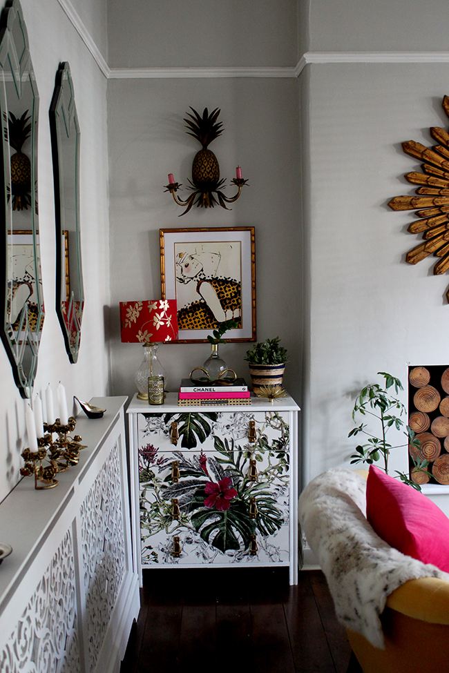 Swoon Worthy Living Room - wallpapered chest of drawers with pineapple sconce