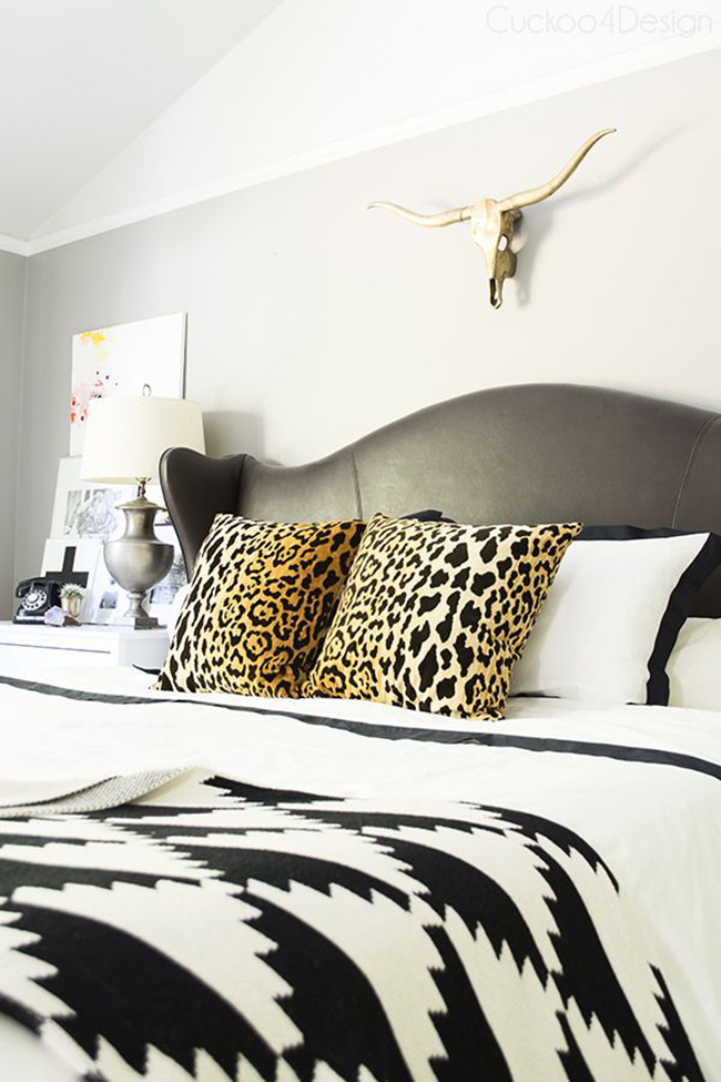 Cuckoo4Design neutral bedroom with leopard print cushions