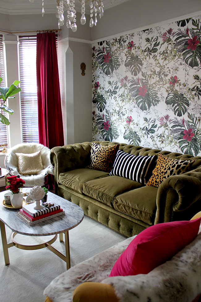 Swoon Worthy - leopard print cushions on olive chesterfield with tropical wallpaper