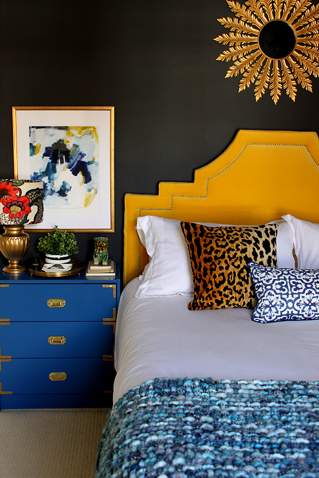 Swoon Worthy bedroom - black walls, leopard print cushion, bright colours