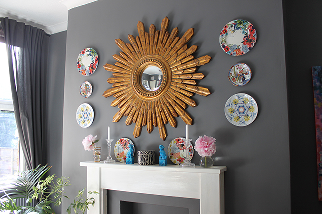 Swoon Worthy dining room in grey with gold starburst mirror