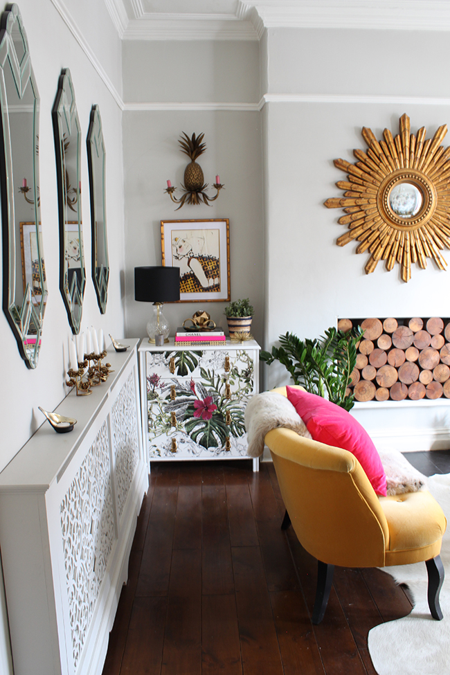 Swoon Worthy - pale grey living room with gold starburst and yellow sofa