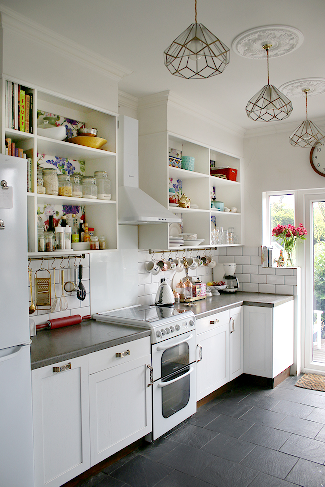 white kitchen with subway tile and colourful accents - see more at www.swoonworthy.org