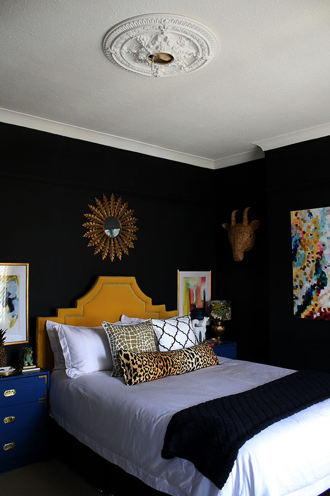 black bedroom with bold accents