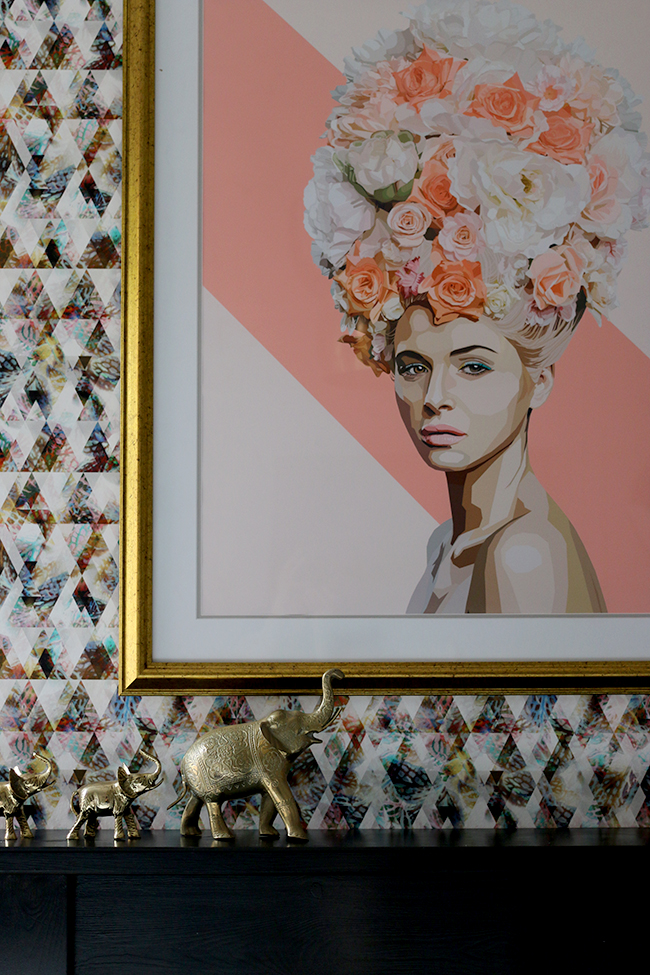 graphic feature wallpaper on chimney breast, black and white marble fireplace with gold trim, peonies - see more on www.swoonworthy.org