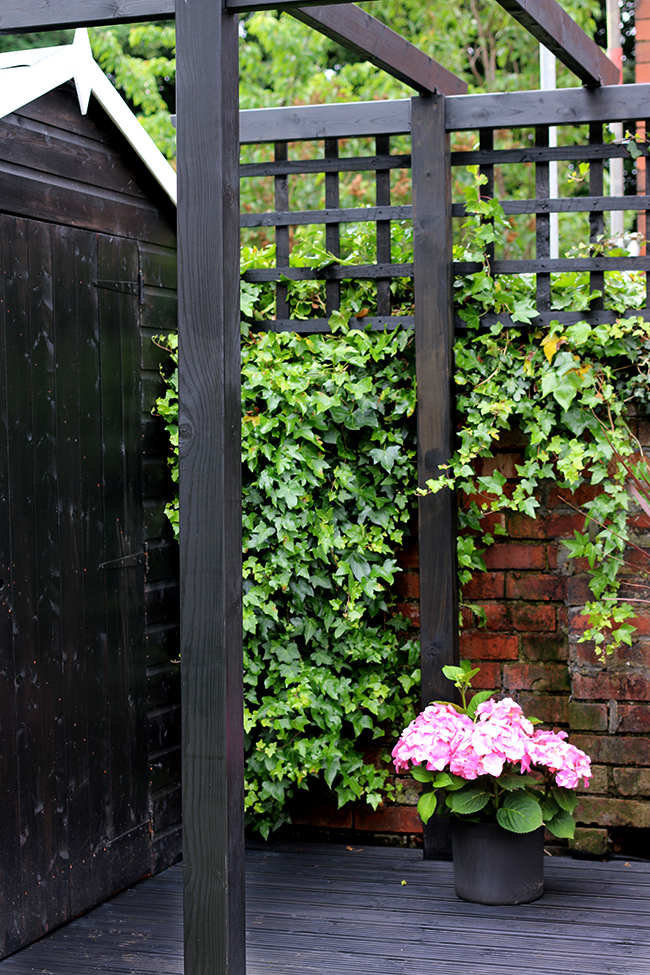 black pergola and decking