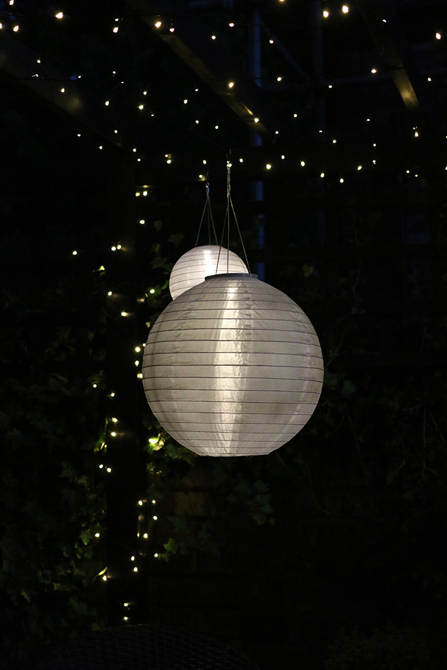 patio with fairy lights and solar chinese lanterns