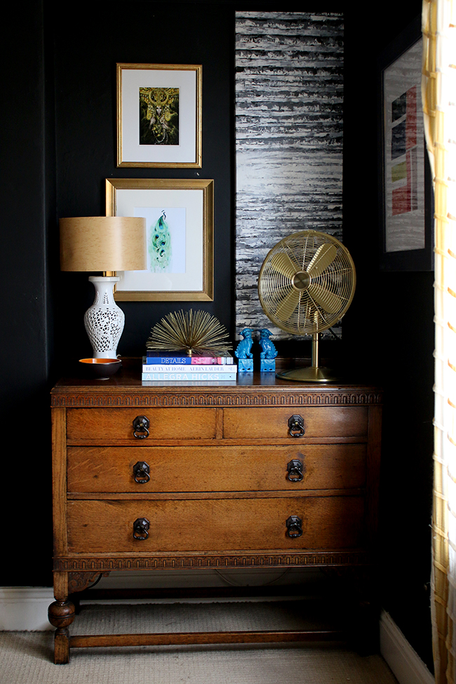 Swoon Worthy - black walls with gallery wall and vintage dresser with gold table fan