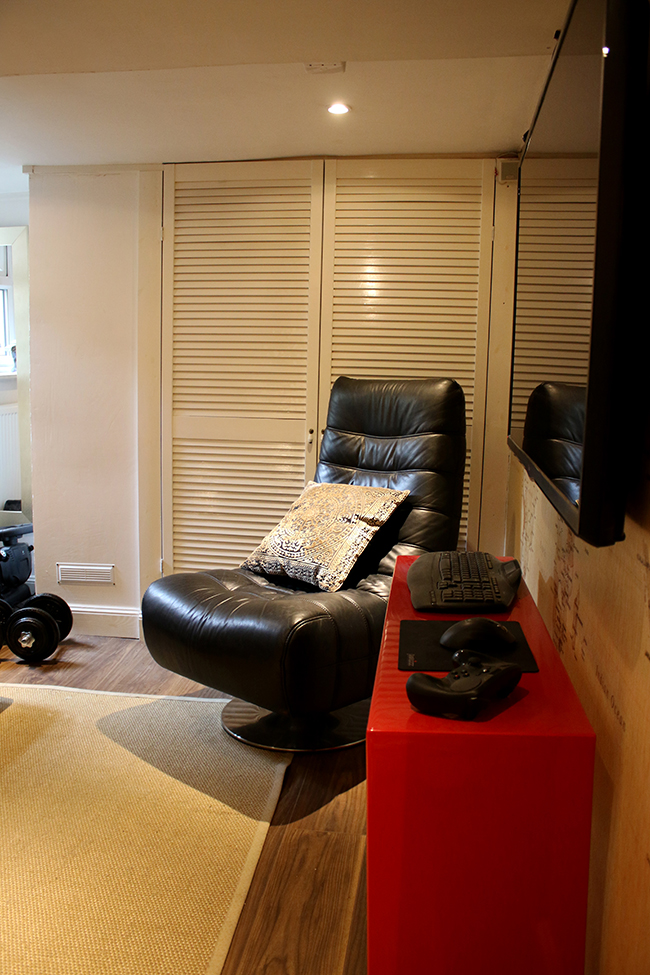 The man cave with large black gaming chair