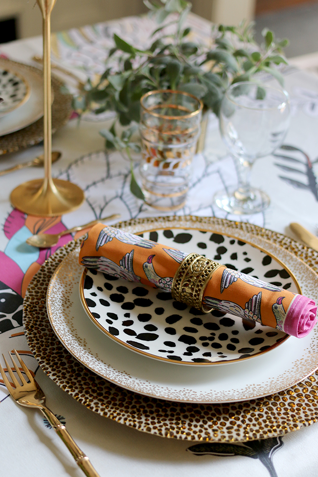 Colourful table setting with plants and animal prints