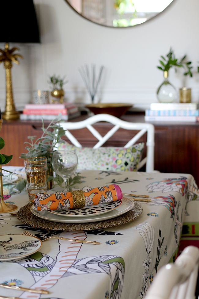 Colourful table setting with plants and animal prints