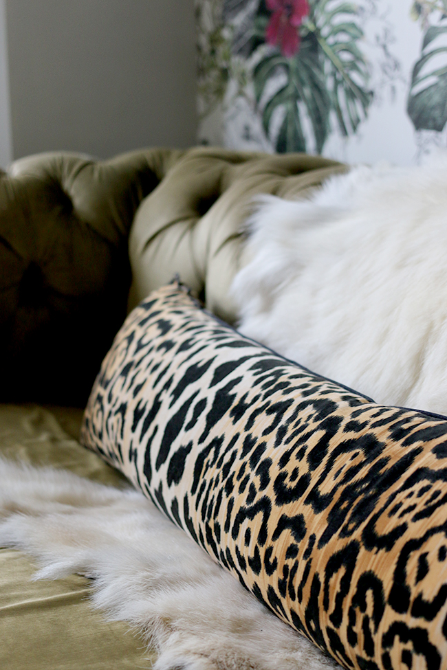 eclectic boho glam style - goats hair hide and leopard print bolster pillow