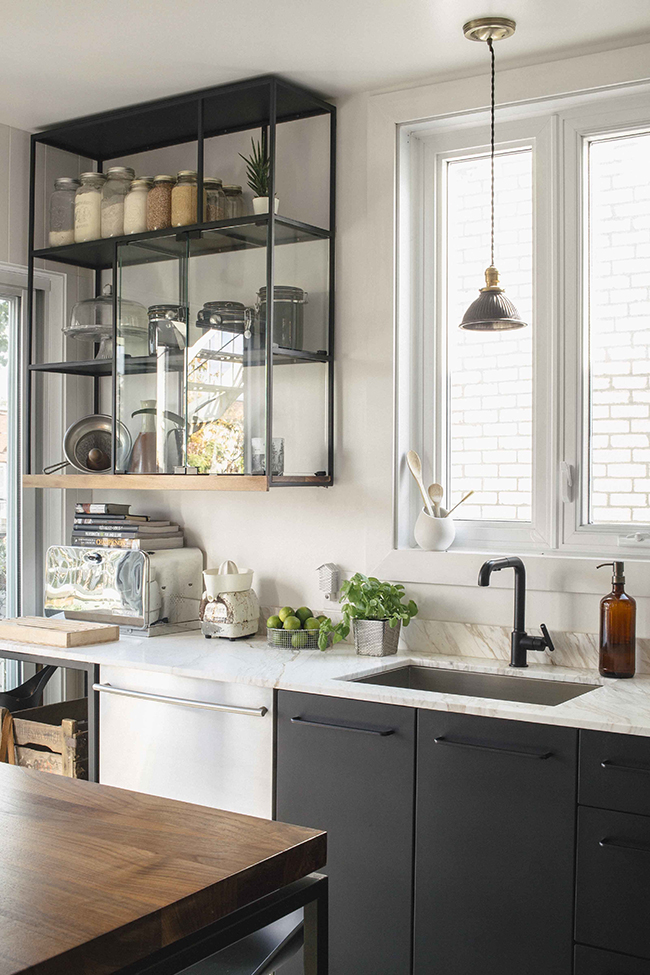 kitchen-with-black-faucet-and-black-open-shelving