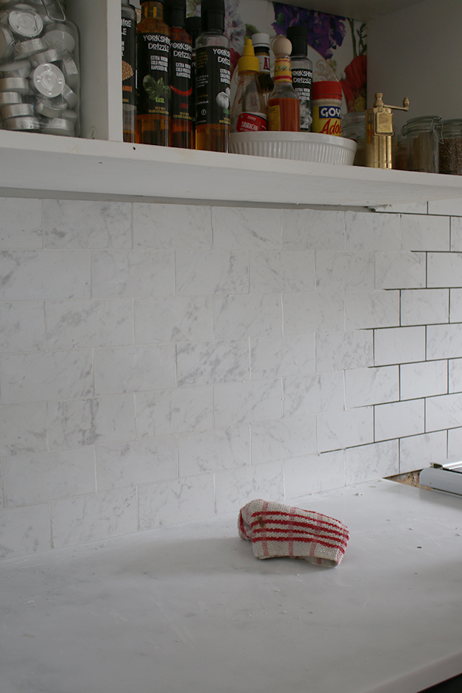 Half way through re-tiling the kitchen using Tile Mountain's marble effect porcelain tiles