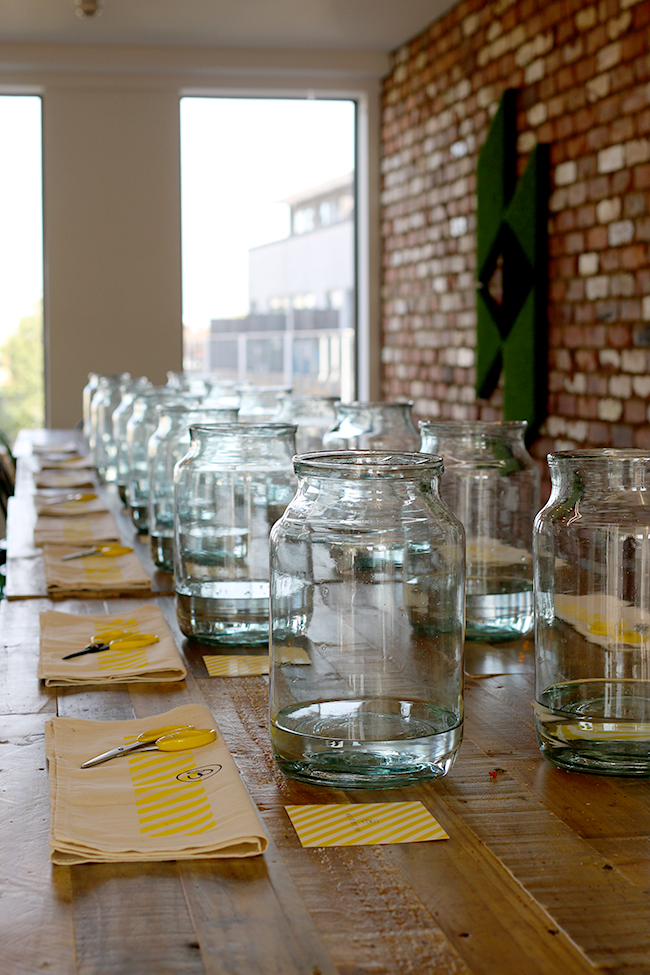 empty glass vases in a row on a table