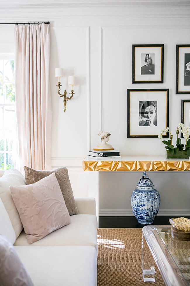 living room with touches of blush pink black and gold