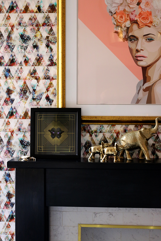 dining room mantle with artwork and gold elephants