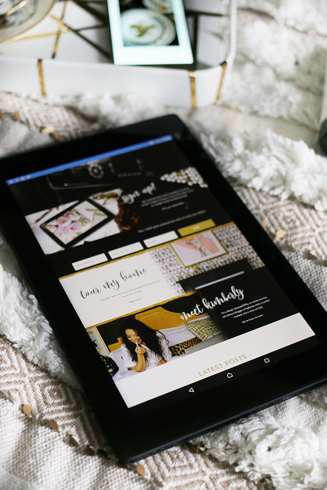 tablet showing Swoon Worthy website on textural bedding