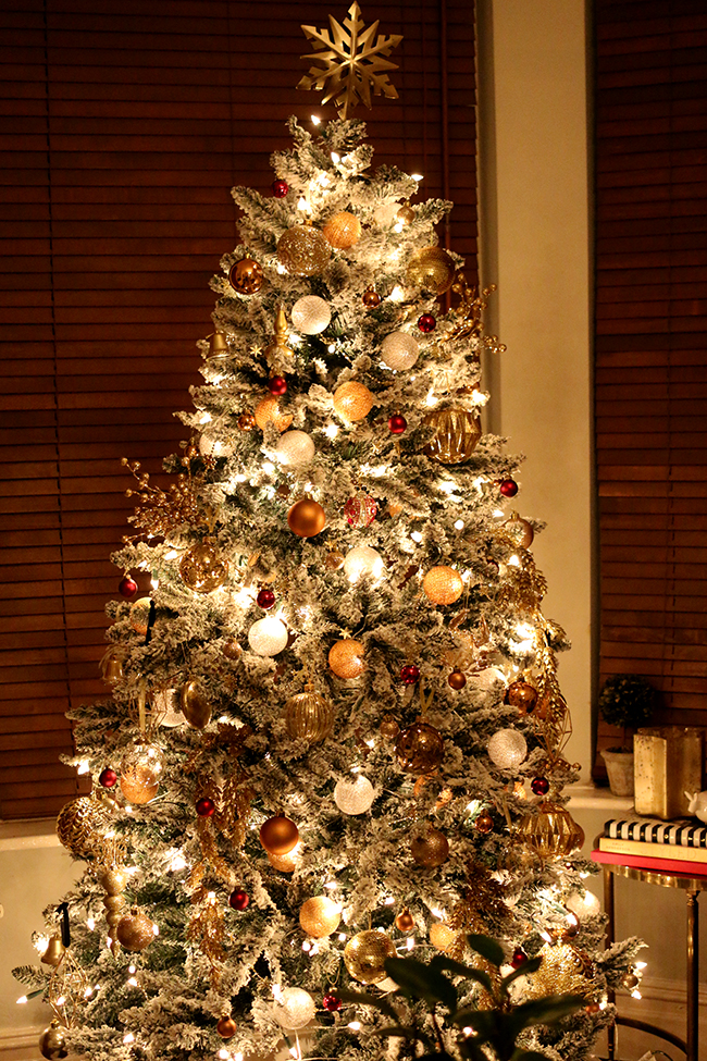 glam flocked Christmas tree in gold and red - see more on www.swoonworthy.org