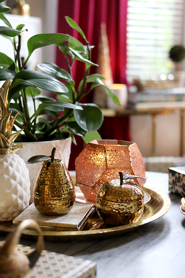 Coffee table vignette styling in gold copper and white christmas styling - see more at www.swoonworthy.org