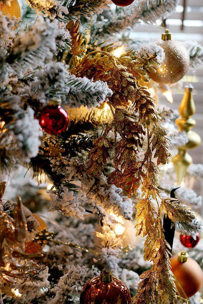 glam flocked Christmas tree in gold and red - see more on www.swoonworthy.org