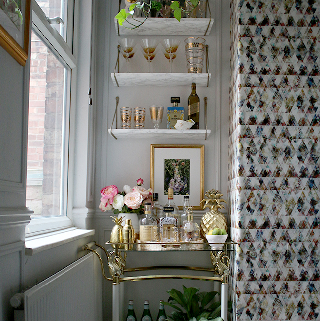 bar cart styling with shelving and graphic wallpaper