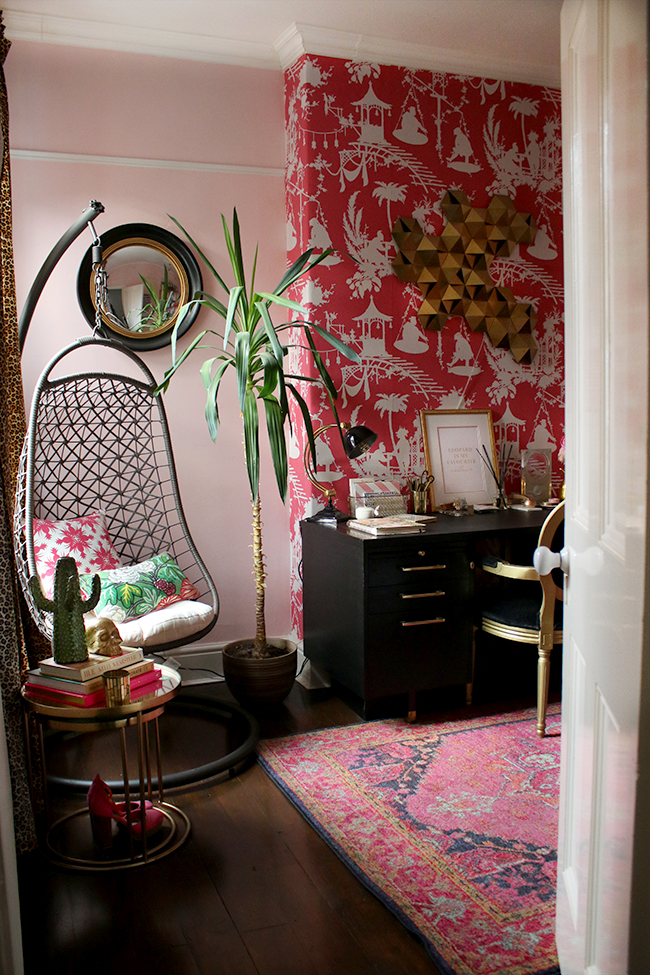 Eclectic boho glam office with blush pink walls and black and gold accents