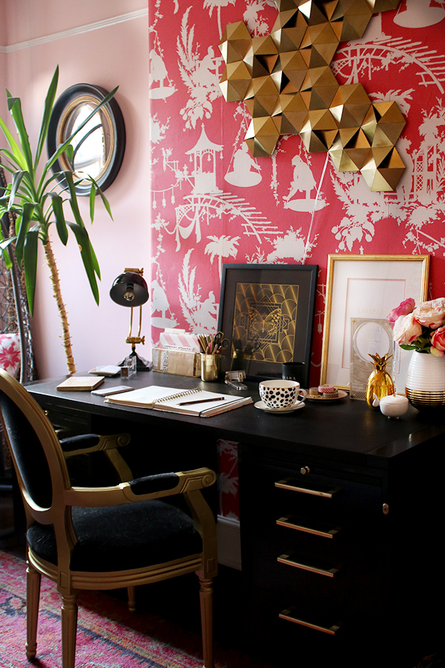 Eclectic boho glam office with blush pink walls and black and gold accents