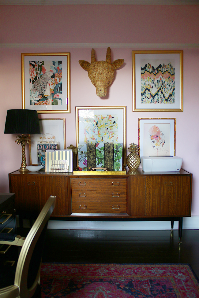 Boho glam office with gallery wall and mid-century modern sideboard