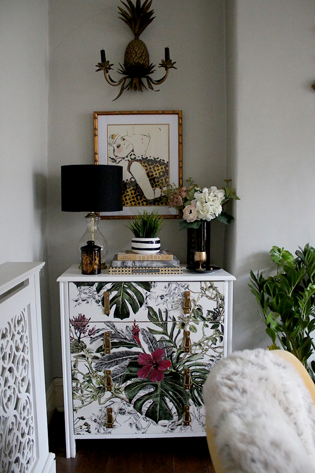 wallpapered chest of drawers with tropical print and leigh viner print