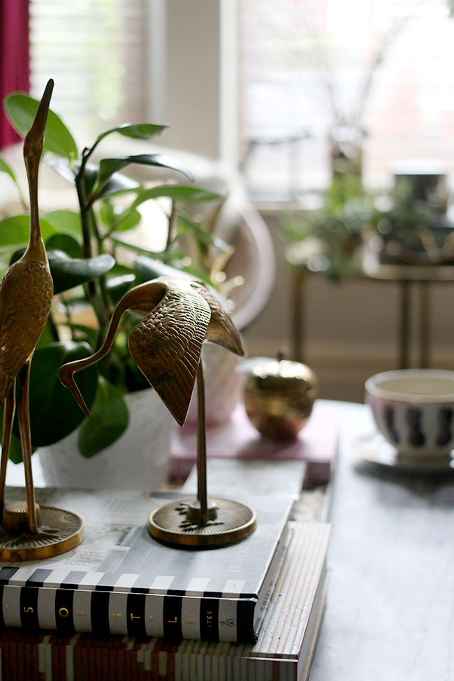 coffee table styling with brass cranes