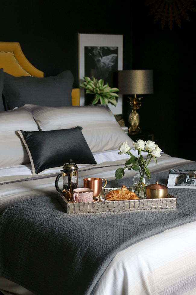 eclectic black bedroom with gold accents