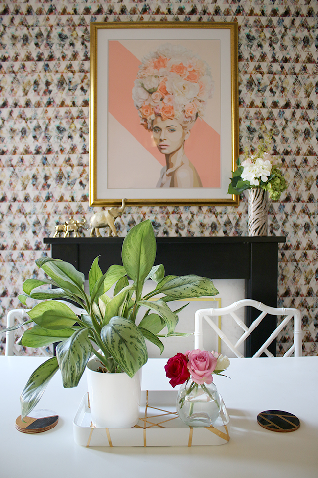 fireplace with colourful wallpaper and dining table