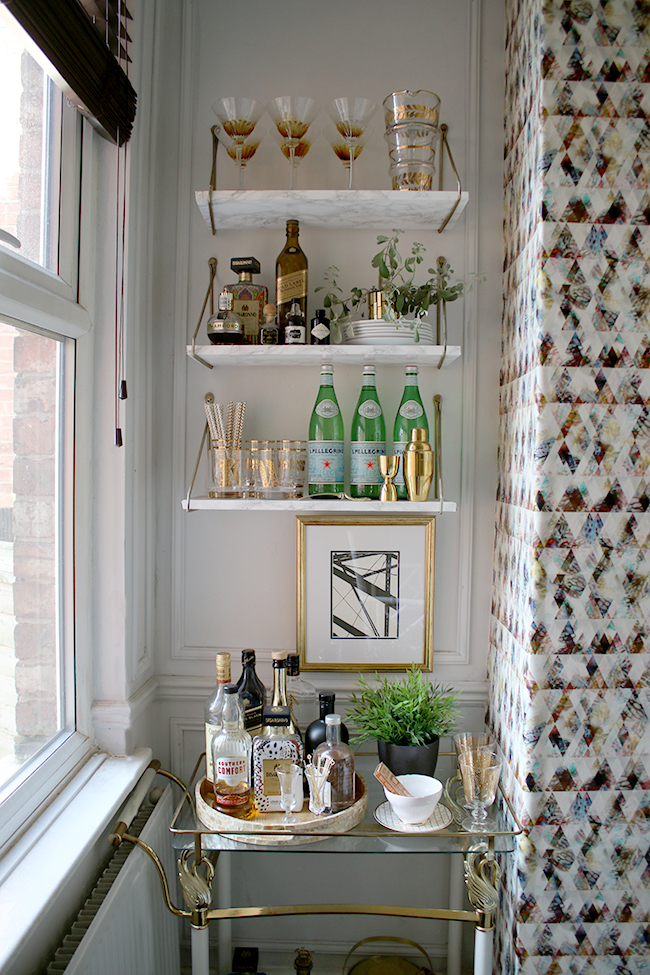 bar cart with marble look shelving