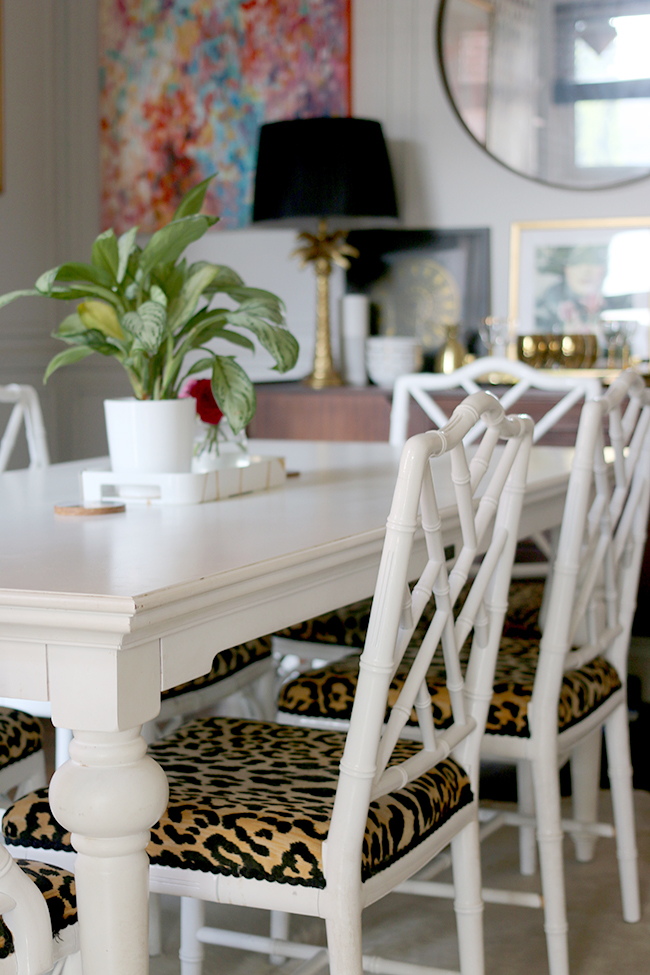 dining room with faux bamboo chairs and leopard print seats