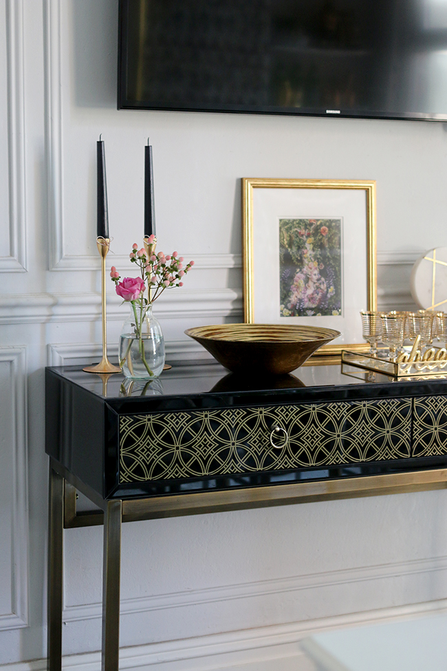 black and gold sideboard styling with gold accents