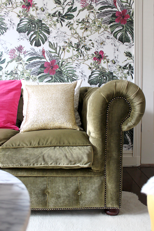 olive velvet chesterfield sofa with botanical wallpaper