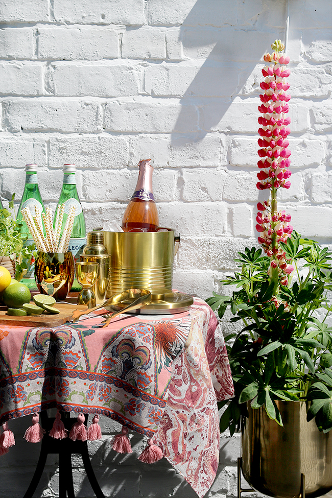 outdoor bar area in gold peach and pink