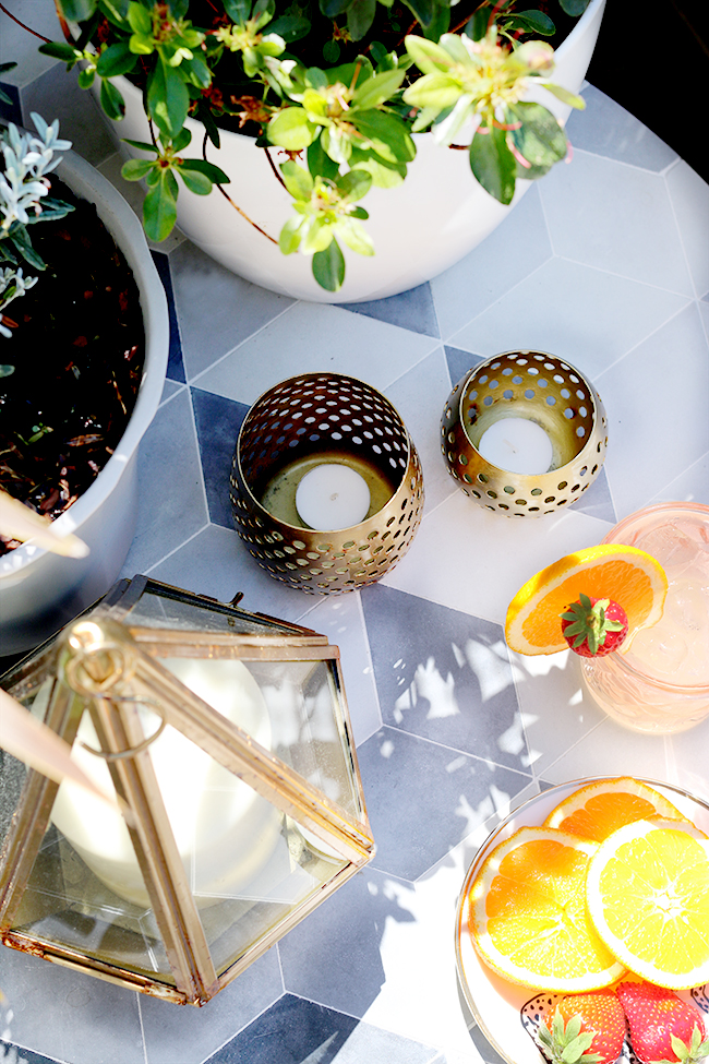 geometric garden side table with gold accents flatlay