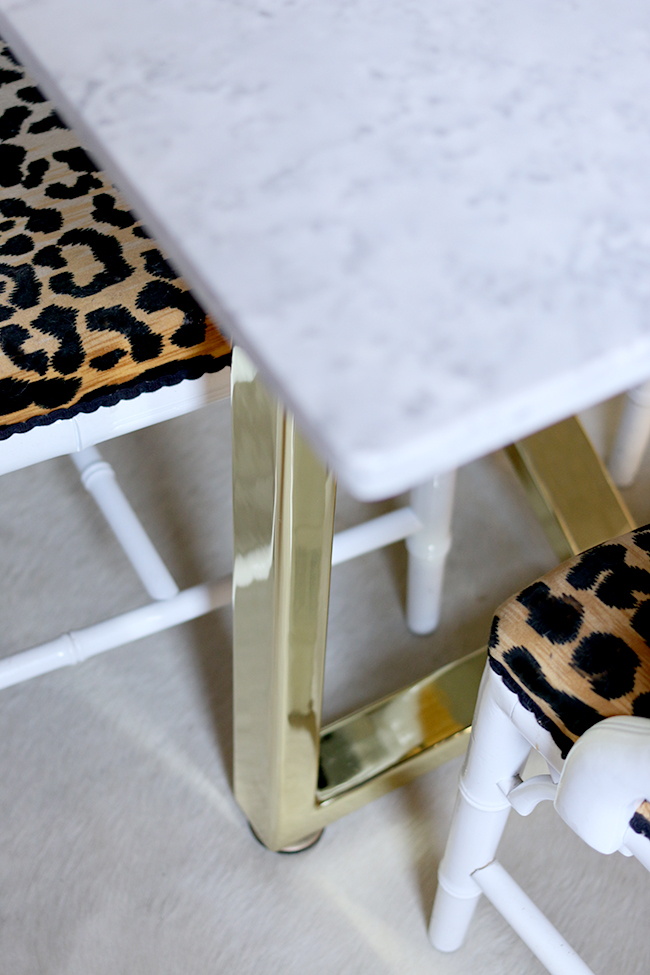 marble table top with brass legs