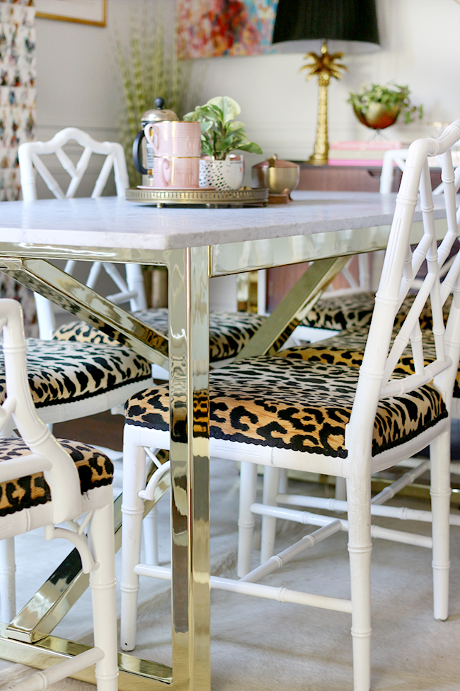 marble topped brass table bespoke custom furniture with white chippendale faux bamboo chairs and leopard print seats